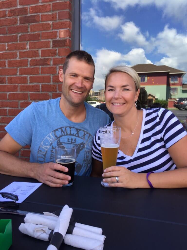 The Best Things to Do in Duluth MN with your Family featured by top US family travel blog, Travel with a Plan: image of a Husband and wife at Canal Park Brewery