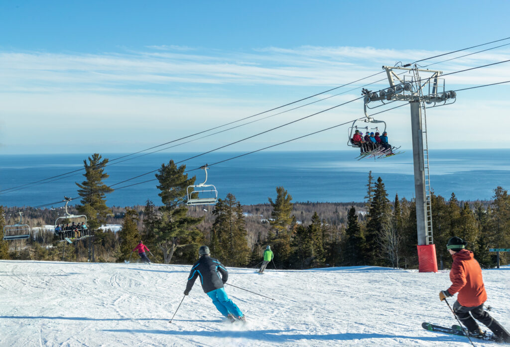 Looking for the best Midwest USA downshill skiing?  Lutsen Mountains Ski Resort is by far the best skiing in Minnesota and will become your family favorite!  Learn all about Lutsen and what to expect from Top U.S. travel blog, Travel With A Plan.  #skiinginMinnesota #Lutsen #Minnesotaskiing #snowboardinginMinnesota #winteractivities #bestplacestoski