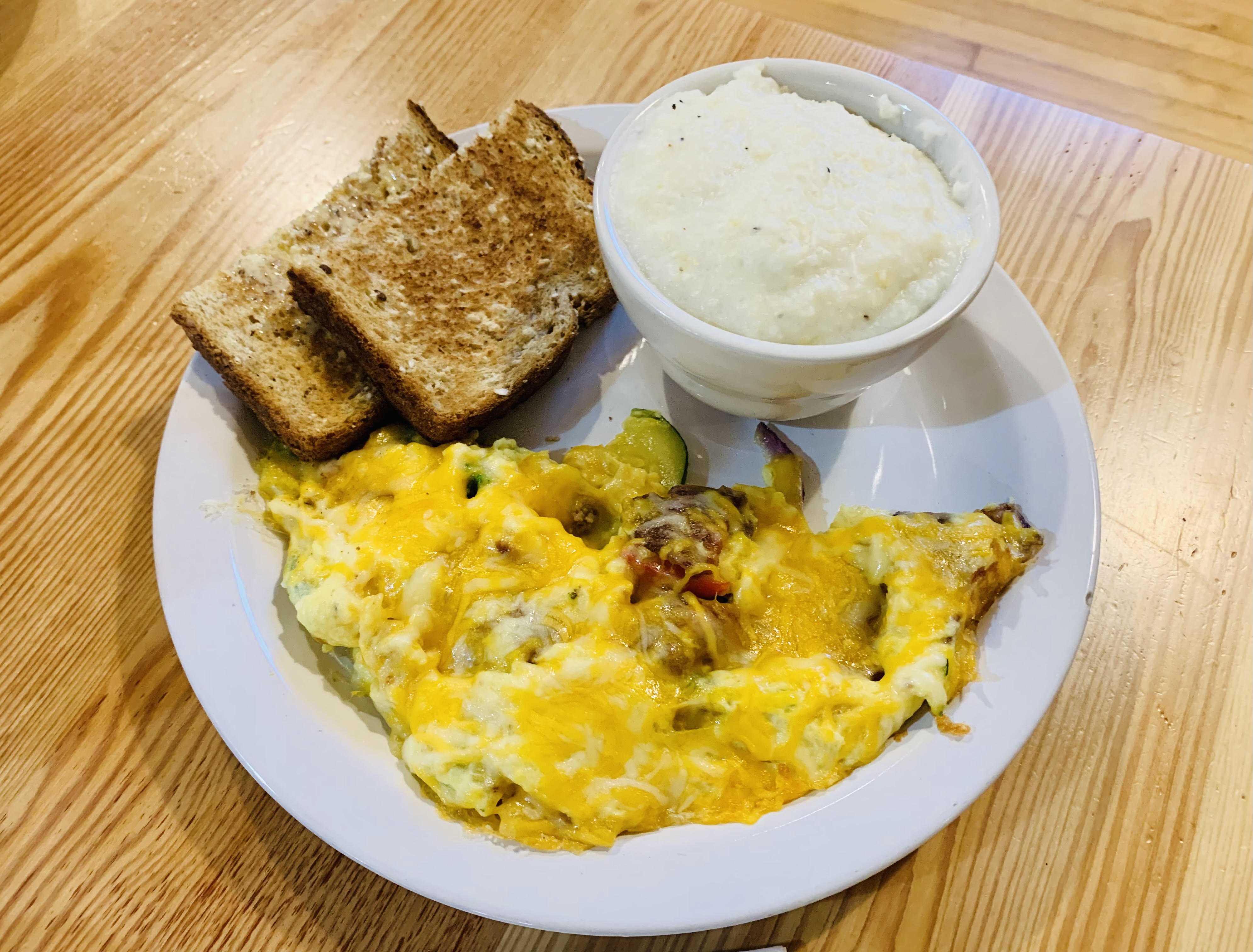 Scrambled eggs and grits (Featured as one of the best restaurants in Whitefish, Montana by top US family travel blog, Travel With A Plan!)