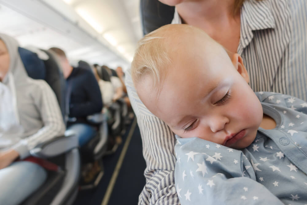 Learn the best tips for flying with kids from top US family travel blog, Travel With A Plan!