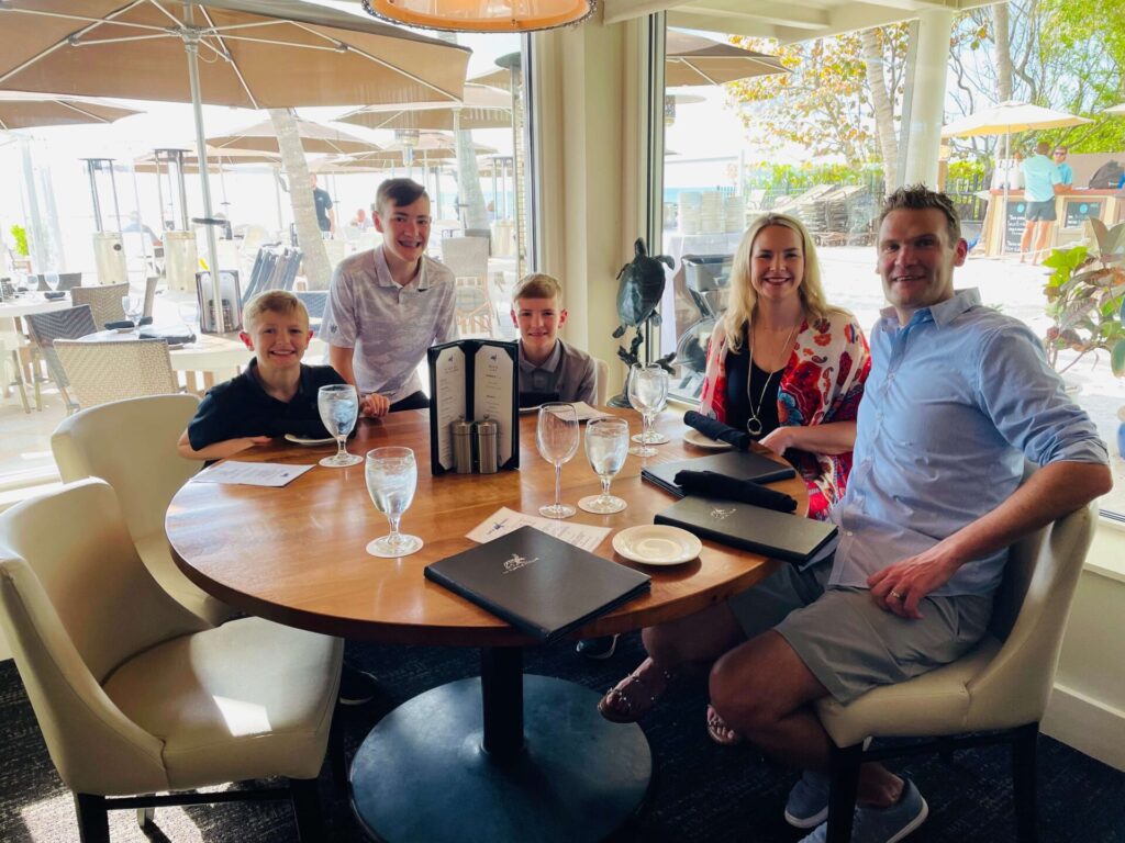 Family photo eating at the best restaurant in Naples, Florida.