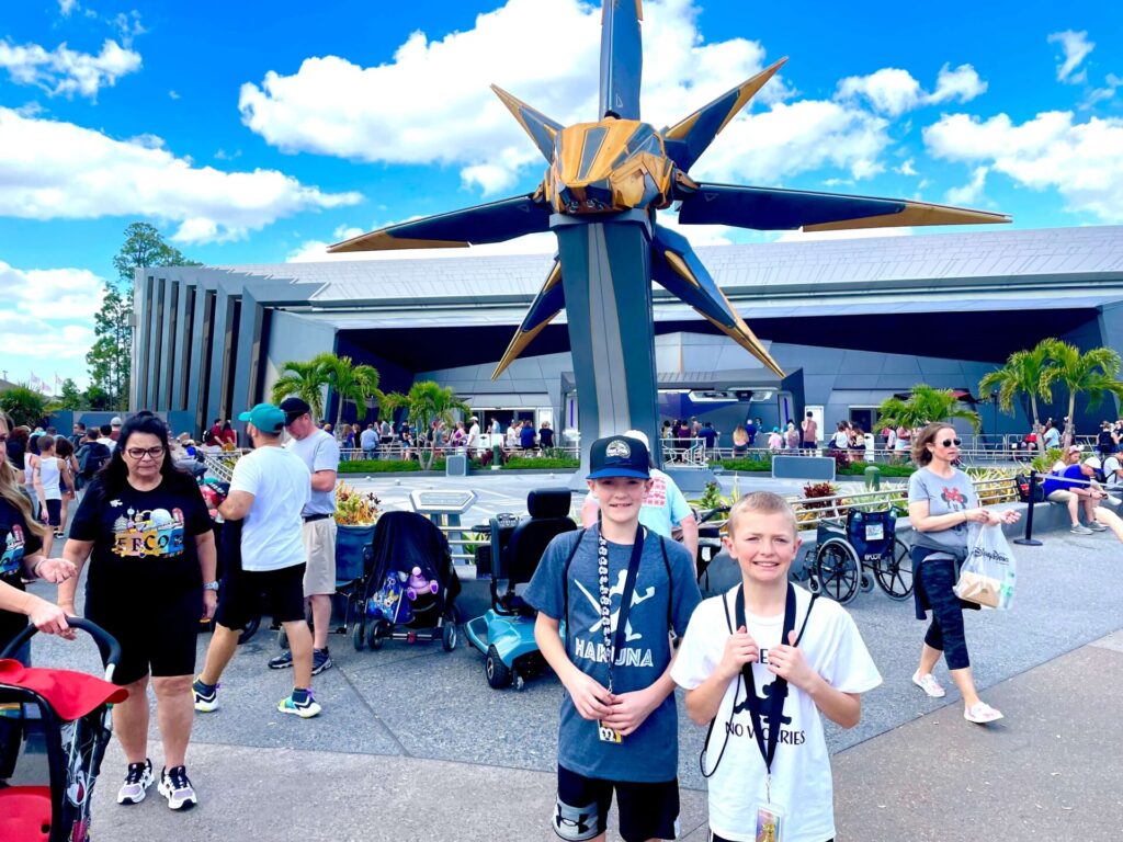 Boys standing outside of Guardians of the Galaxy:  Cosmic Rewind
